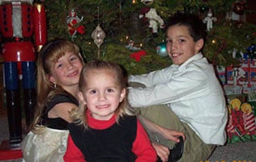 Kids sitting in front of tree